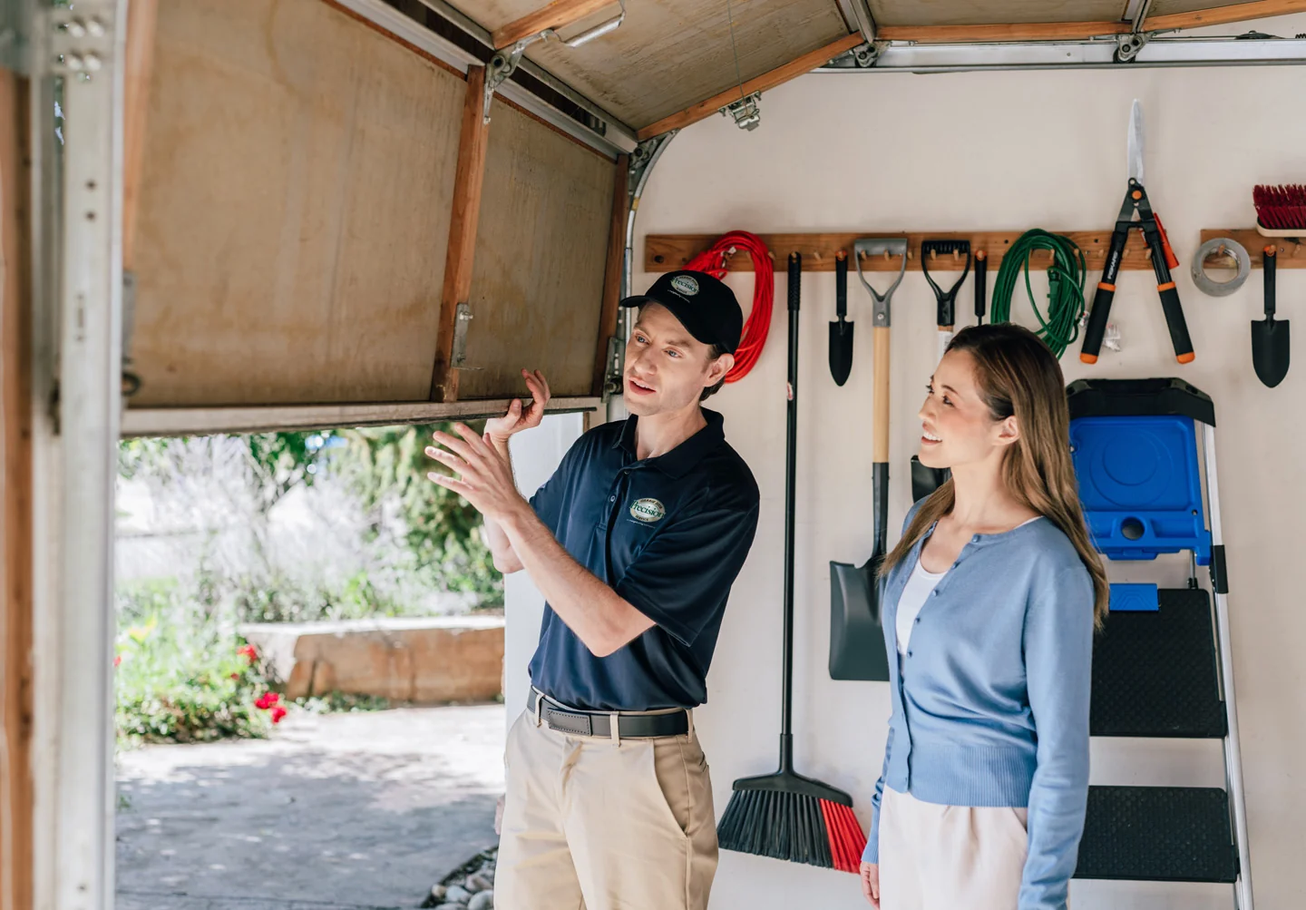 Technician inspecting a garage door